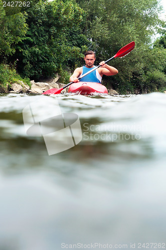 Image of Man kayaking