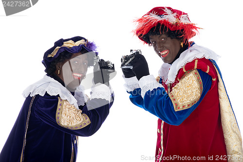 Image of Zwarte Piet and his co-worker are taking photographs
