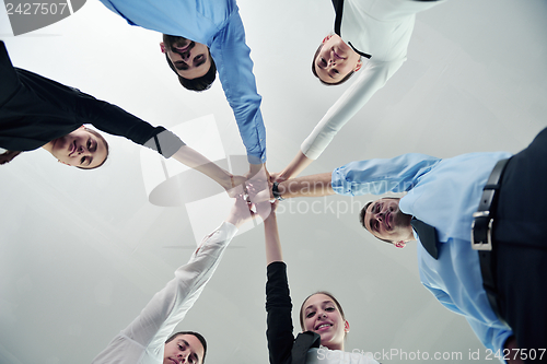 Image of business people group joining hands