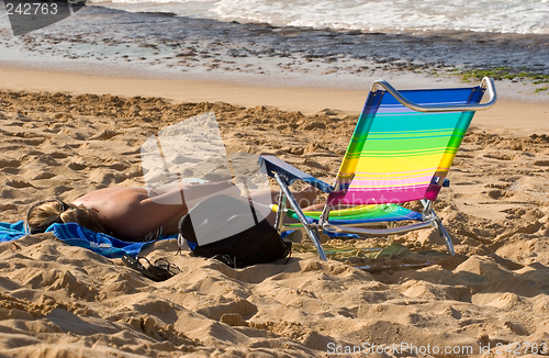Image of Woman Sunbathing on Beach 2