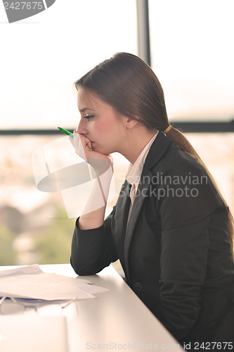 Image of tired  business woman at the office