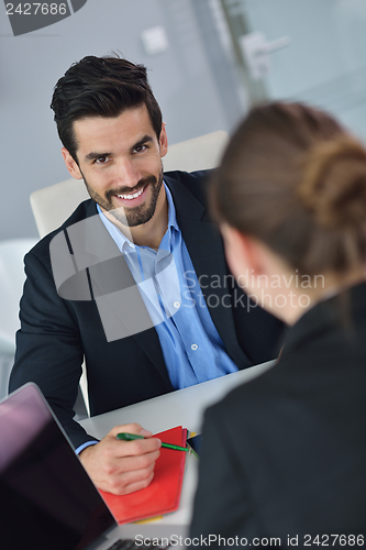 Image of business people in a meeting at office