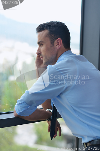 Image of business man talking by cellphone