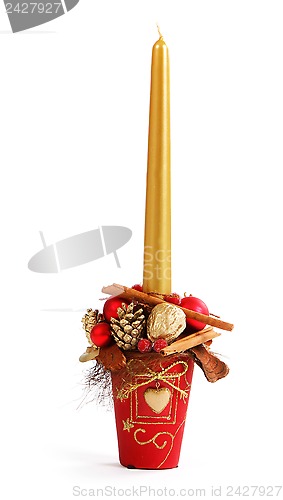 Image of Christmas decor with gold candle