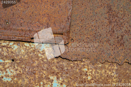 Image of brown rusty surface with spots