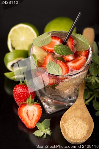 Image of mojito strawberry cocktails on a black background
