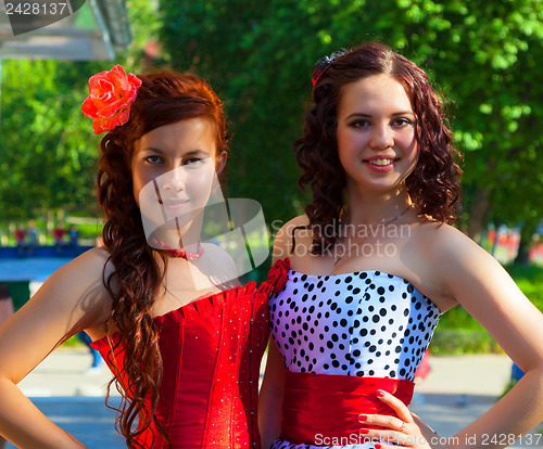 Image of Two young girls in beautiful dresses