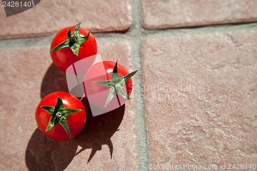 Image of three cherry tomatoes 