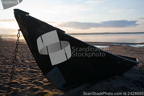 Image of old boat on sea shore