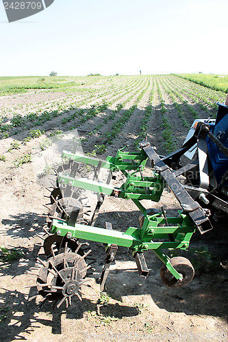 Image of special equipment on tractor for weed