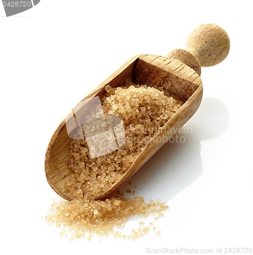 Image of wooden scoop with brown sugar