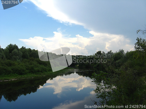 Image of evening summer landscape with clouds and river