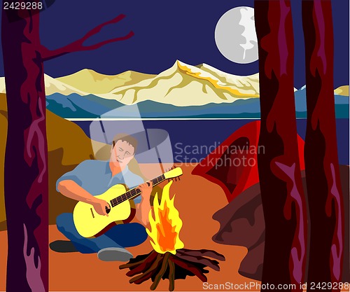 Image of Man Camping Playing Guitar