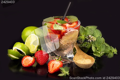 Image of mojito strawberry cocktails on a black background