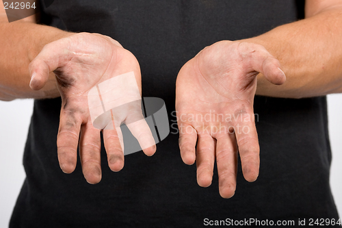 Image of worker with dirty hands