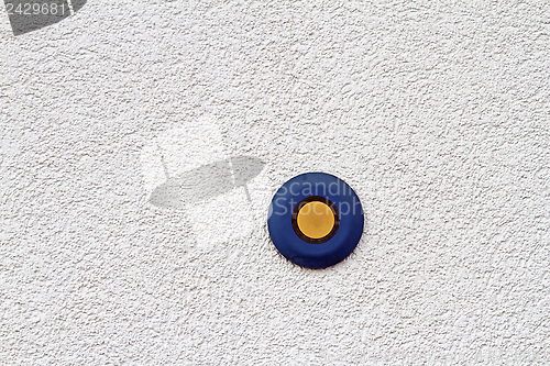 Image of blue and yellow button