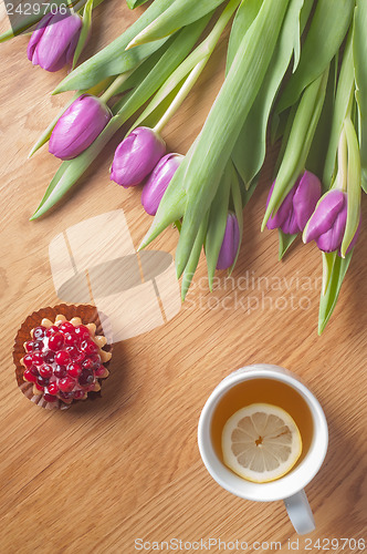 Image of Violet tulips on the wood