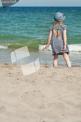 Image of Small girl on sand beach
