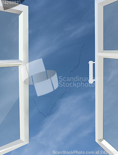 Image of opened window to the blue sky