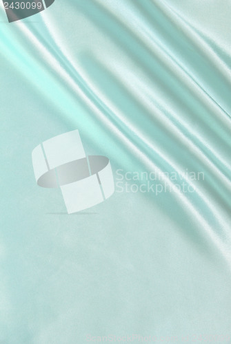 Image of Smooth elegant blue silk as background 