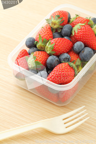 Image of Strawberry and blueberry mix in plastic container