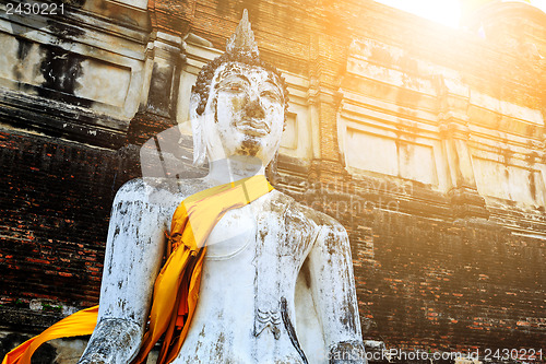 Image of Ancient Buddha under sunlight