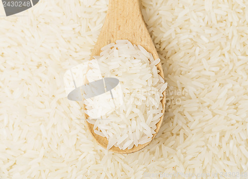 Image of White rice with teaspoon