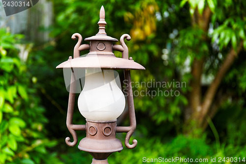 Image of Street lamp in the green garden