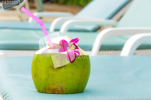 Image of Sunbathing with coconut drink