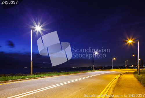 Image of Empty asphalt road at night