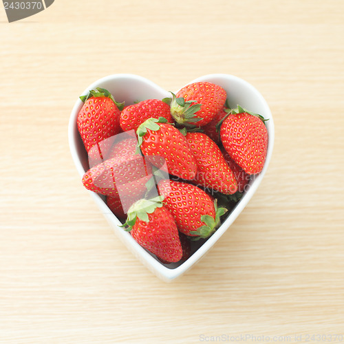 Image of Strawberry in heart shape bowl