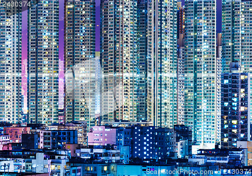 Image of Overpopulated modern building in Hong Kong at night