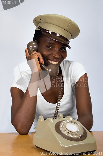 Image of African girl with old phone
