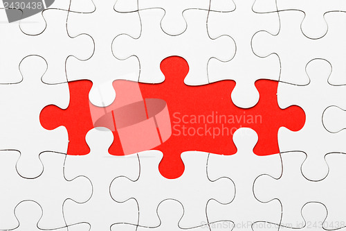 Image of Incomplete puzzle in red color