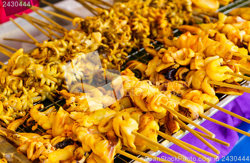 Image of Thai style roasted stick on street