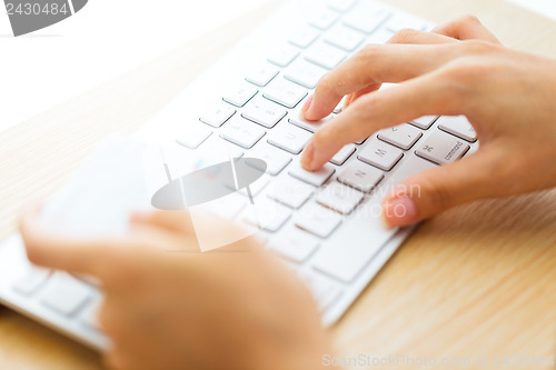 Image of Online shopping with credit card and keyboard