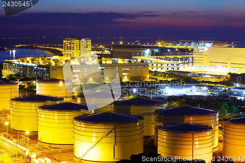 Image of Oil tanks for cargo service at night