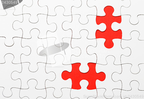 Image of Incomplete puzzle with missing piece