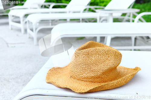 Image of Wicker hat at pool side