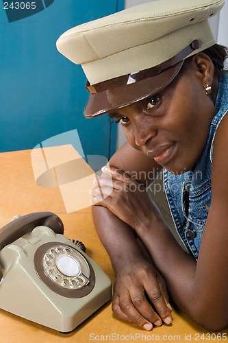 Image of African girl with old phone