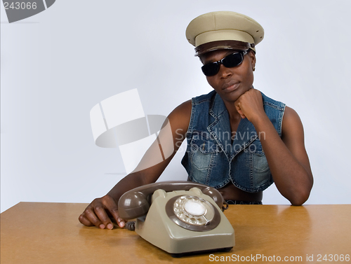 Image of African girl with old phone