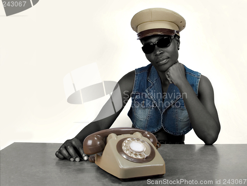 Image of African girl with old phone