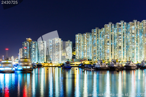 Image of Overpopulated apartment building at night