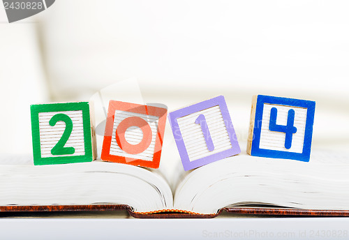 Image of Alphabet block with 2014 on book