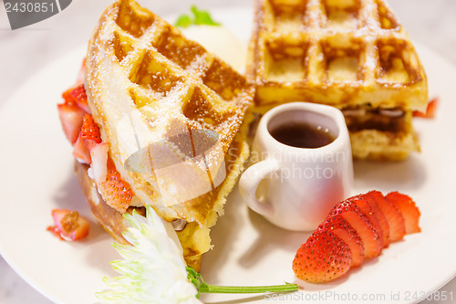 Image of Waffles with syrup and strawberries