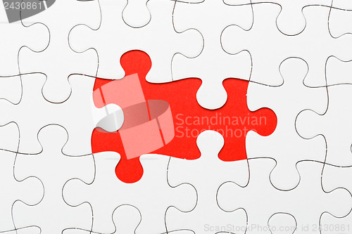 Image of Incomplete puzzle with missing piece