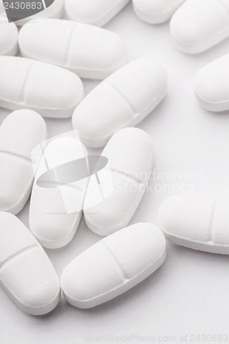 Image of White pills isolated on white