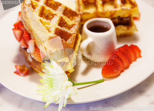 Image of Waffles with syrup and strawberries