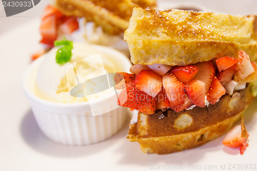 Image of Waffles with ice-cream and strawberries