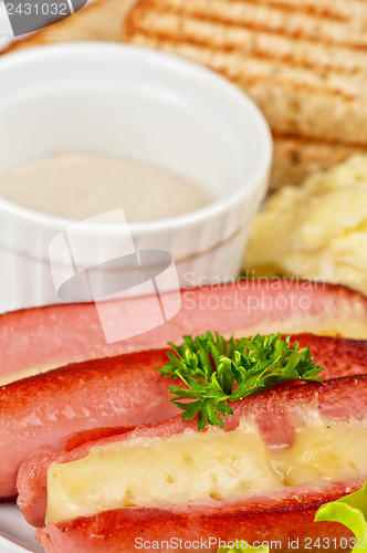 Image of sausages with cheese and omelette